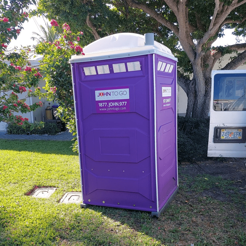A porta potty at an outdoor Suffolk County event