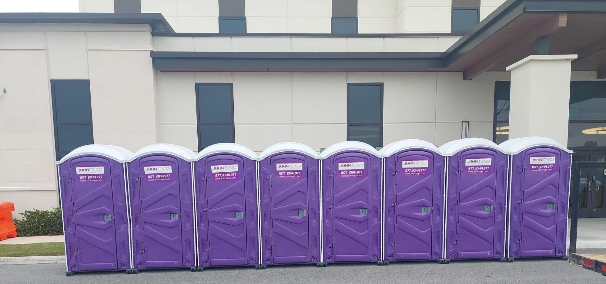 row of disaster relief porta potty units